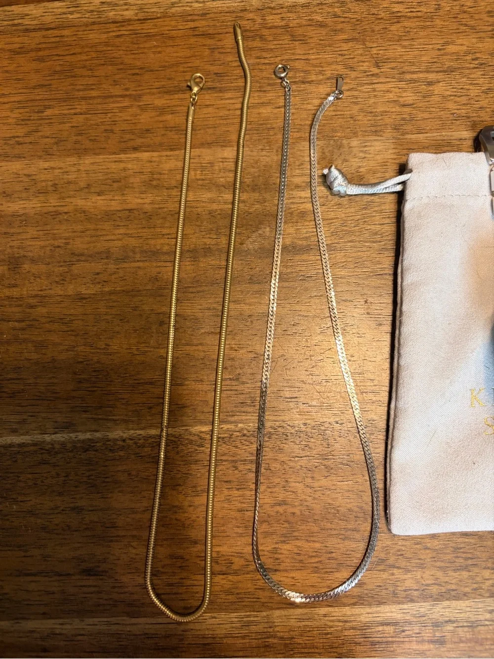 Bundle of Gold and Silver Herringbone necklaces and two watches
